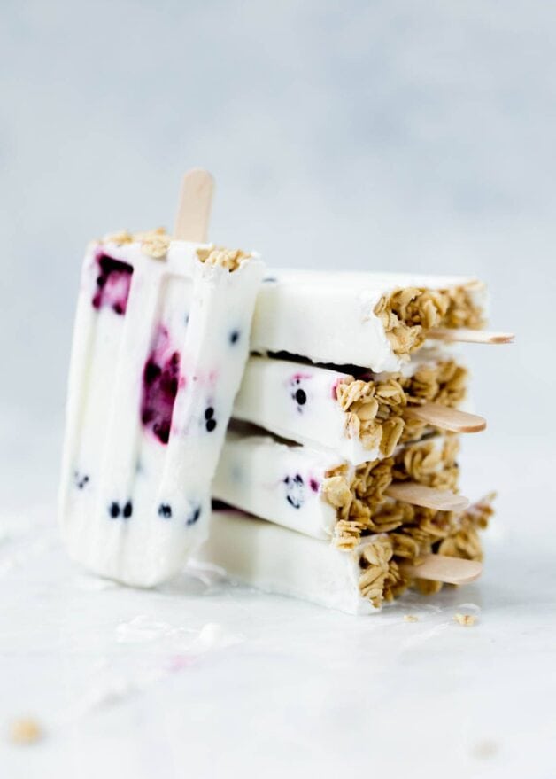 Frozen Coconut Greek Yogurt Breakfast Popsicles with berries and granola. Oh yeah.