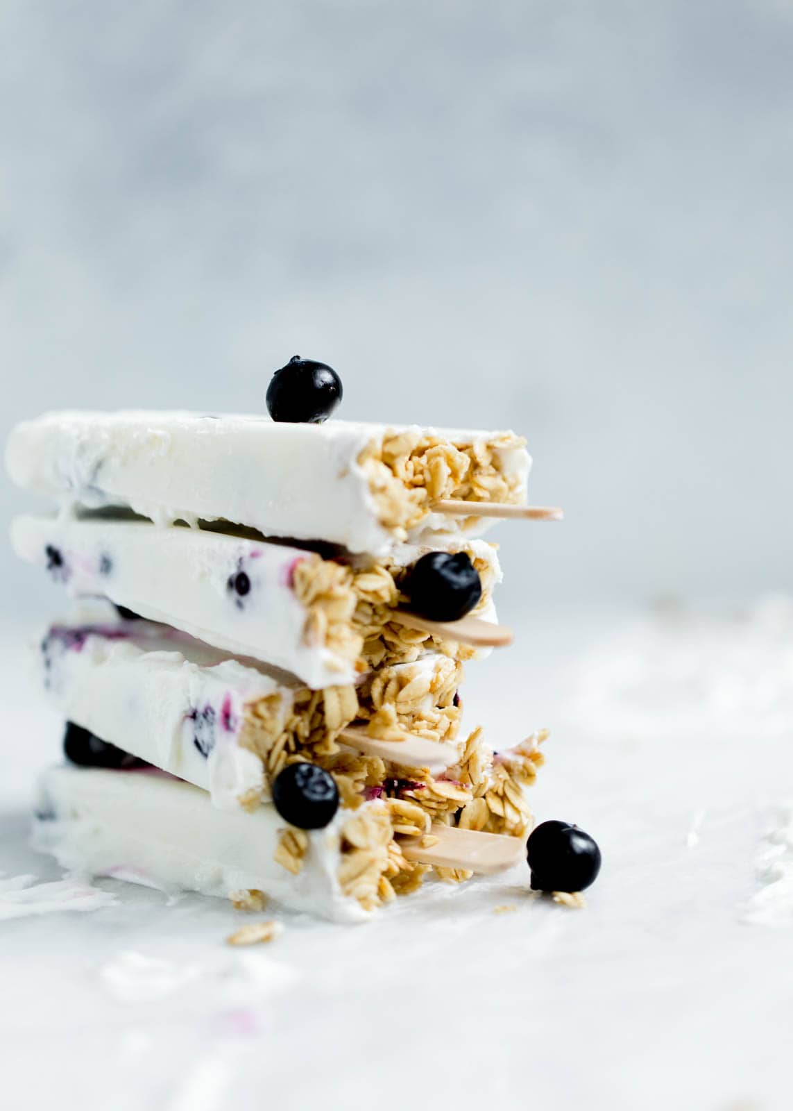 Frozen Coconut Greek Yogurt Breakfast Popsicles with berries and granola. Oh yeah.