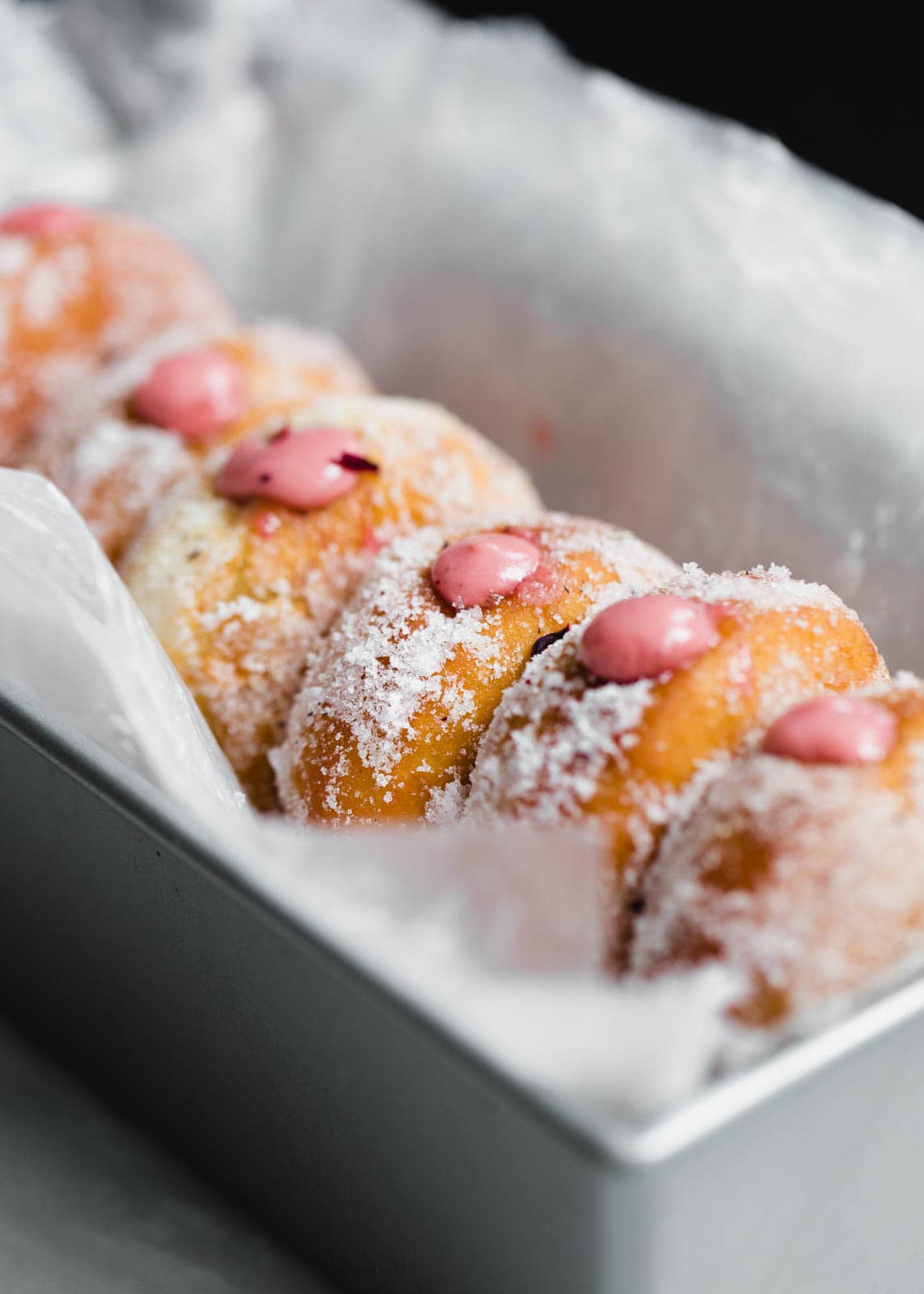 Golden and fried to perfection, these yeasted donuts are tossed in a hibiscus sugar and stuffed with a hibiscus pastry cream. Uhm, DROOL.