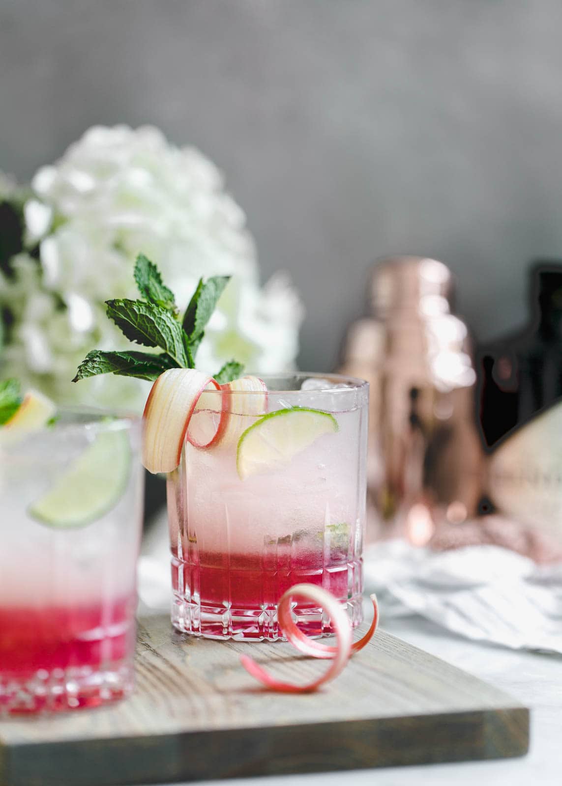 A thirst-quenching Rhubarb Mint Mojito made with rhubarb syrup, fresh mint, and lime. YUM.