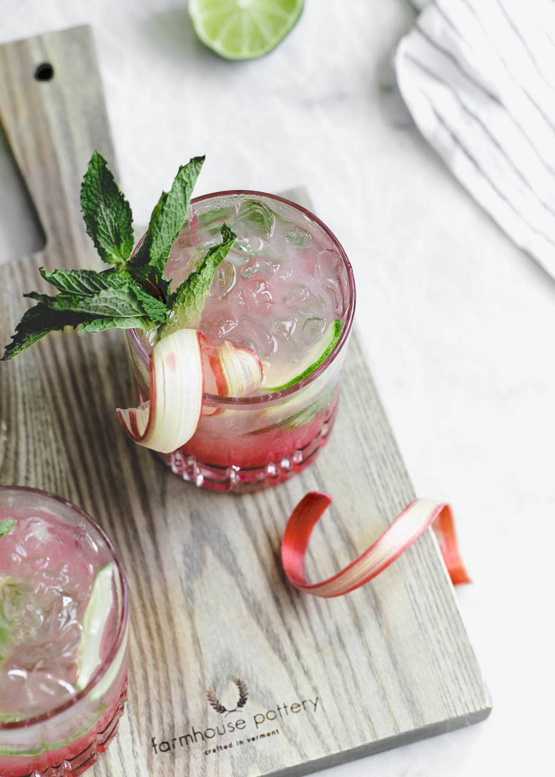 A thirst-quenching Rhubarb Mint Mojito made with rhubarb syrup, fresh mint, and lime. YUM.