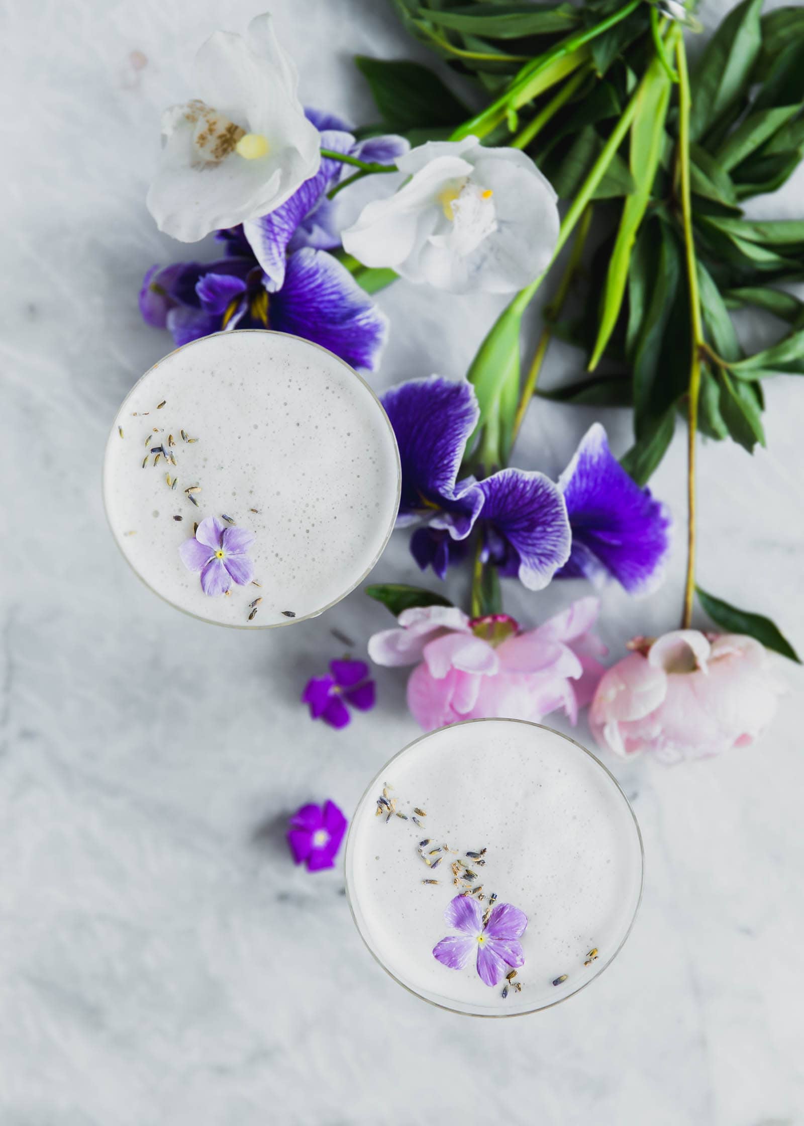 Lavender Coconut Vodka Sours next to a bouquet 