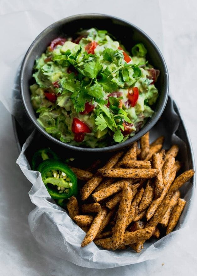 Secret ingredient alert! This Ultimate Skinny Guacamole is lighter and healthier, yet just as creamy and delicious. You'll never eat "regular" guac again!