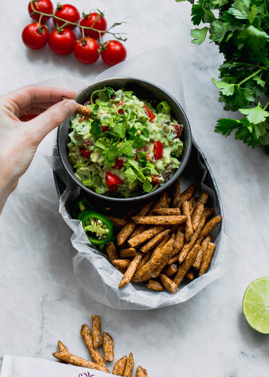 Secret ingredient alert! This Ultimate Skinny Guacamole is lighter and healthier, yet just as creamy and delicious. You'll never eat "regular" guac again!