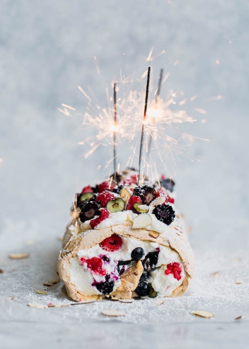 A Triple Berry Meringue Roulade perfect for summer nights. Easy to make and a total crowd-pleaser!