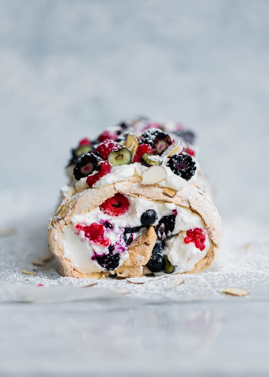 A Triple Berry Meringue Roulade perfect for summer nights. Easy to make and a total crowd-pleaser!