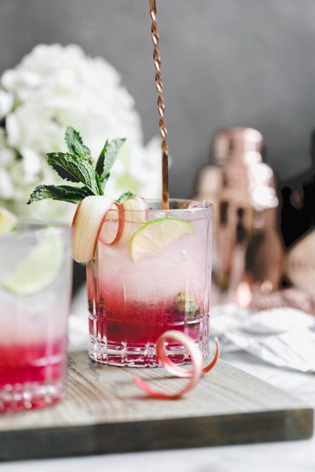 A thirst-quenching Rhubarb Mint Mojito made with rhubarb syrup, fresh mint, and lime. YUM.