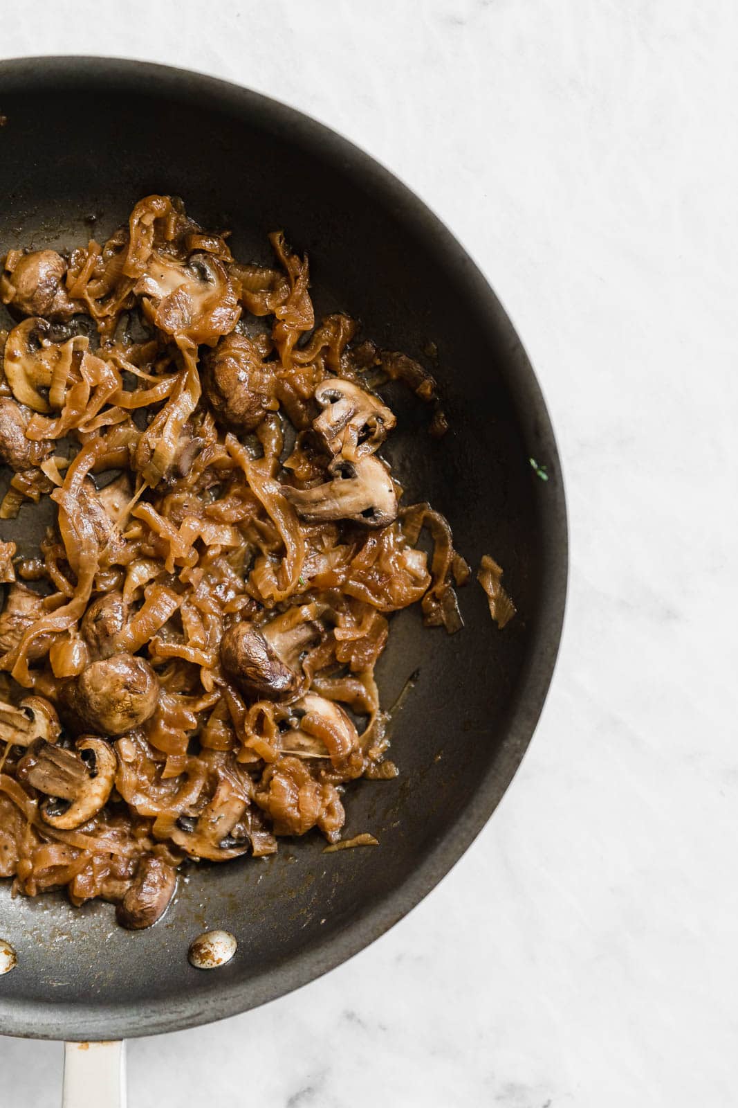 caramelized onions and mushrooms in a skillet
