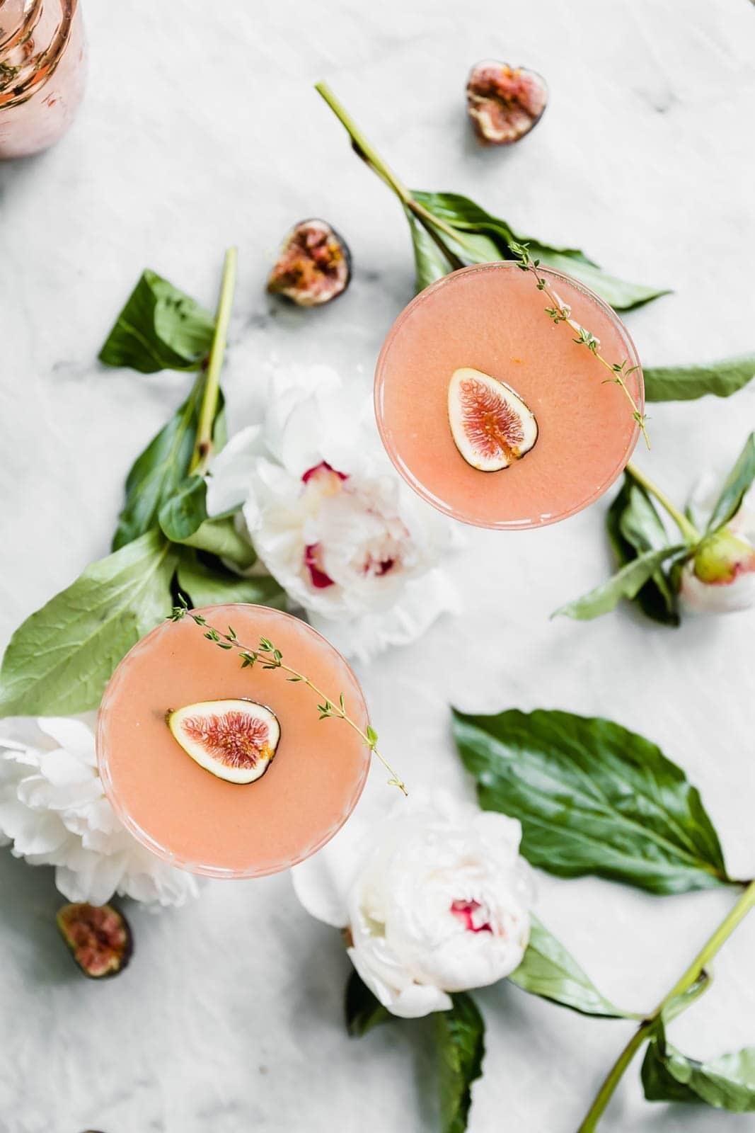 It's about figgin thyme for a cocktail! This fig and thyme cocktail is festive, bright, and perfect for your next get together!