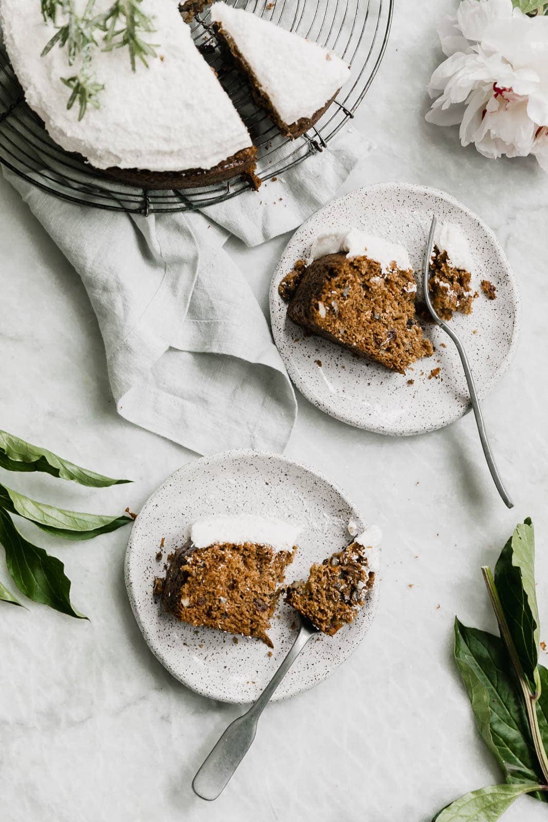 slices of coconut carrot cake on plates