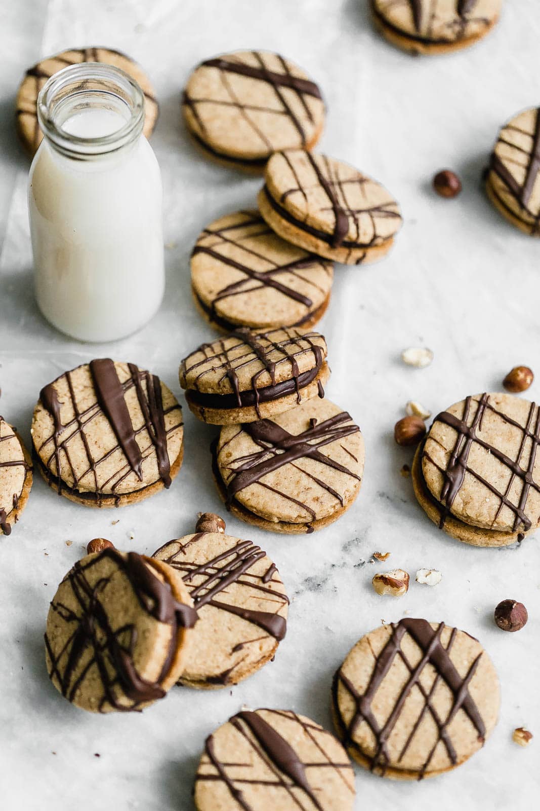 Hazelnut Espresso Sandwich Cookies with glass of milk