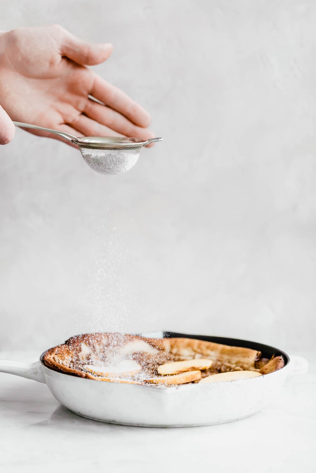 A deliciously epic bourbon brown butter peach dutch baby topped with granola, fresh peaches, and vanilla ice cream! Perfect for a lazy Sunday morning :)
