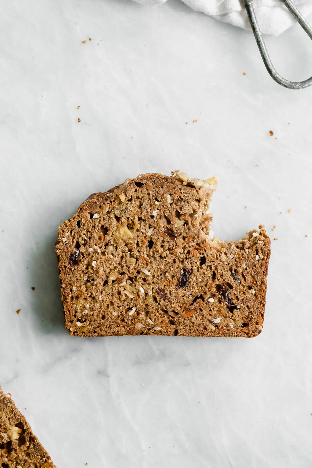 slice of homemade banana bread with bite taken out