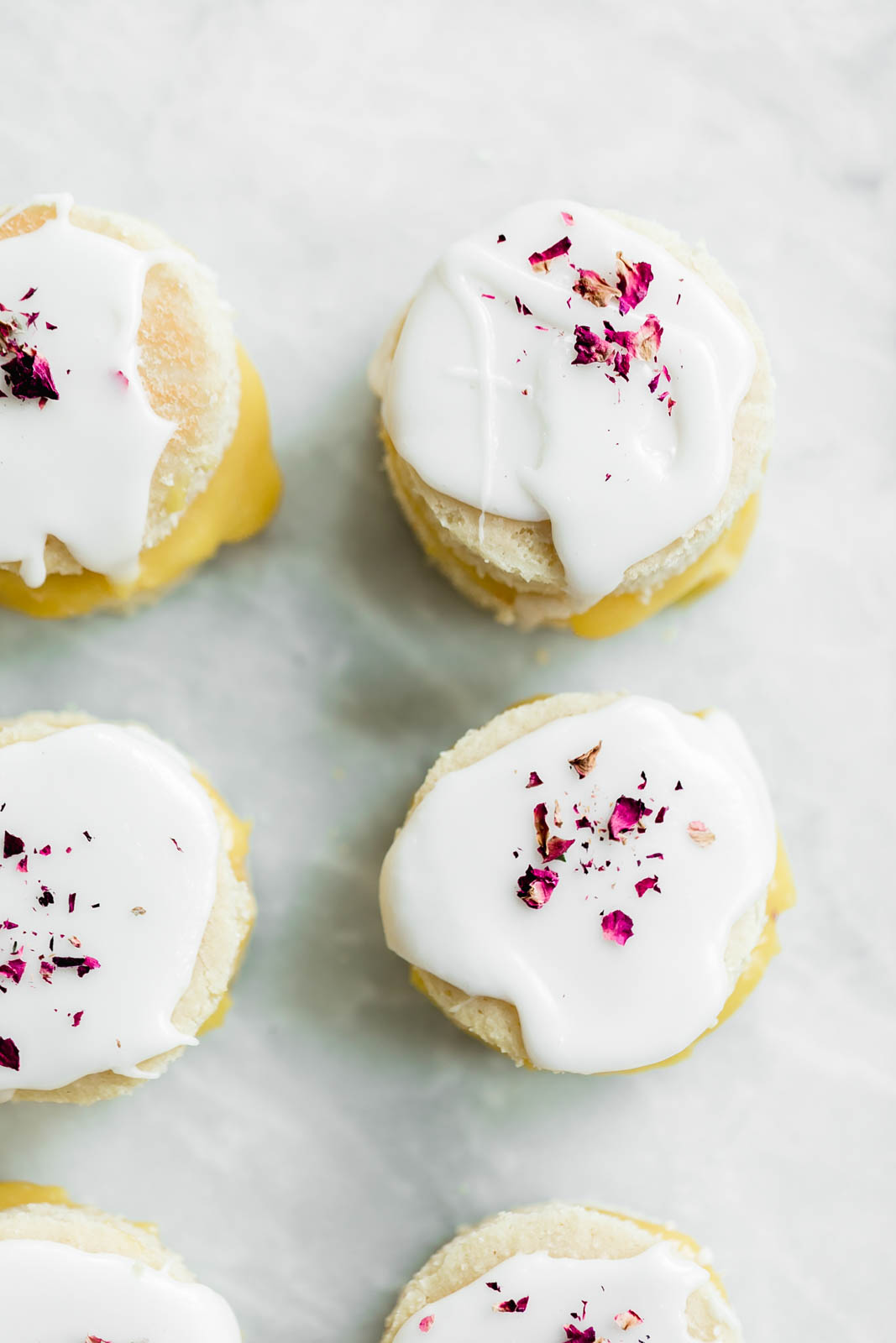 Coconut Lemon Curd Petit Fours: homemade lemon curd sandwiched between two coconut flour cakes and topped with lemon icing. HELLO SPRING!