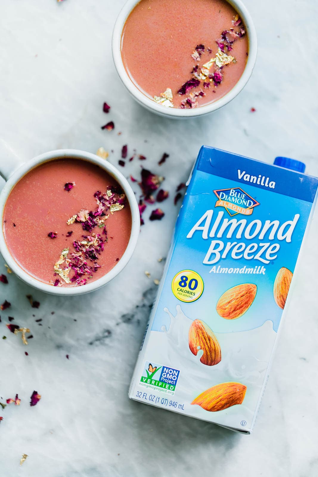 Elevate your bedtime routine with this Pink Moon Milk fit for a princess. Made with vanilla almondmilk, beetroot, turmeric, agave, dried rose hips, and edible gold.