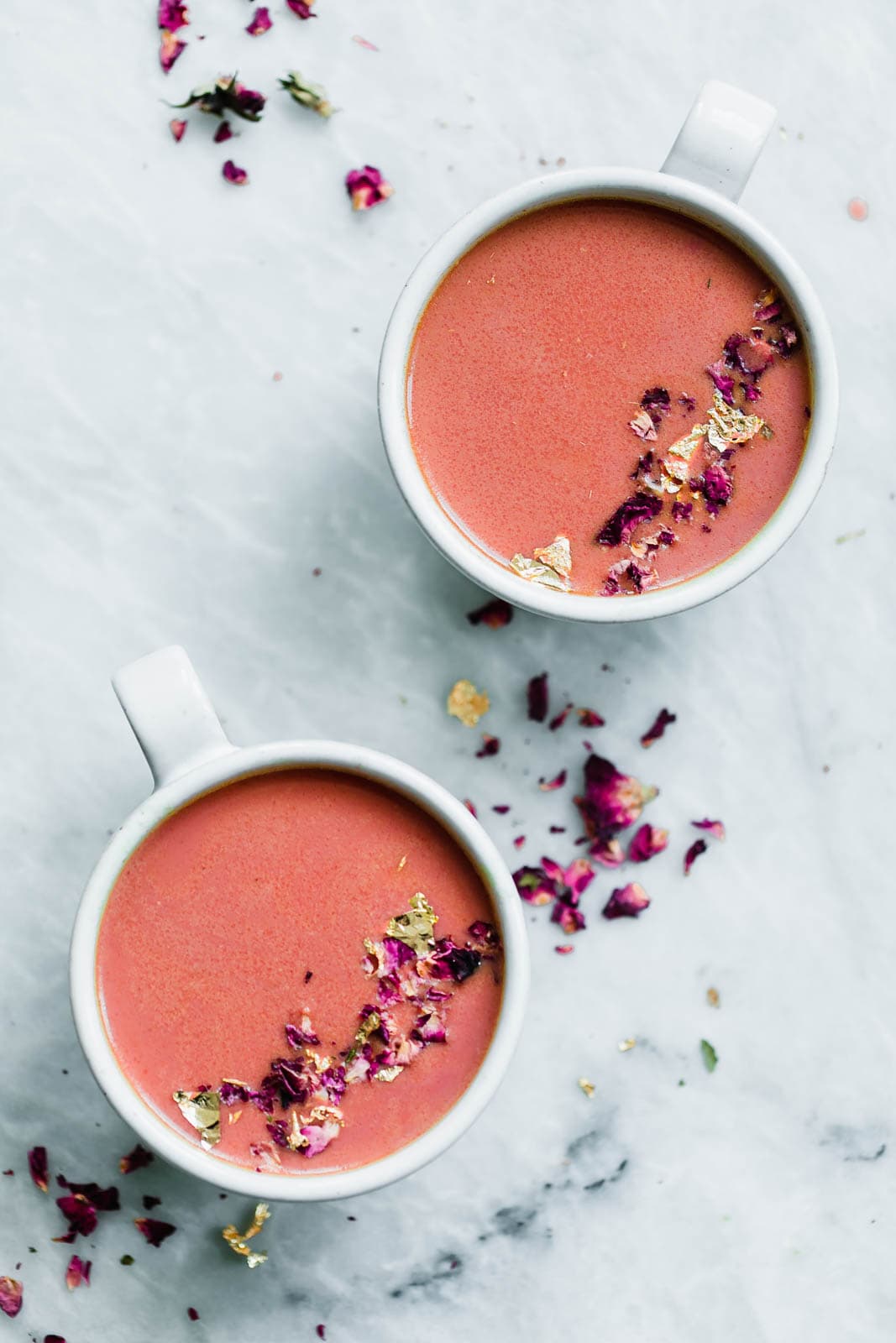 Elevate your bedtime routine with this Pink Moon Milk fit for a princess. Made with vanilla almondmilk, beetroot, turmeric, agave, dried rose hips, and edible gold.