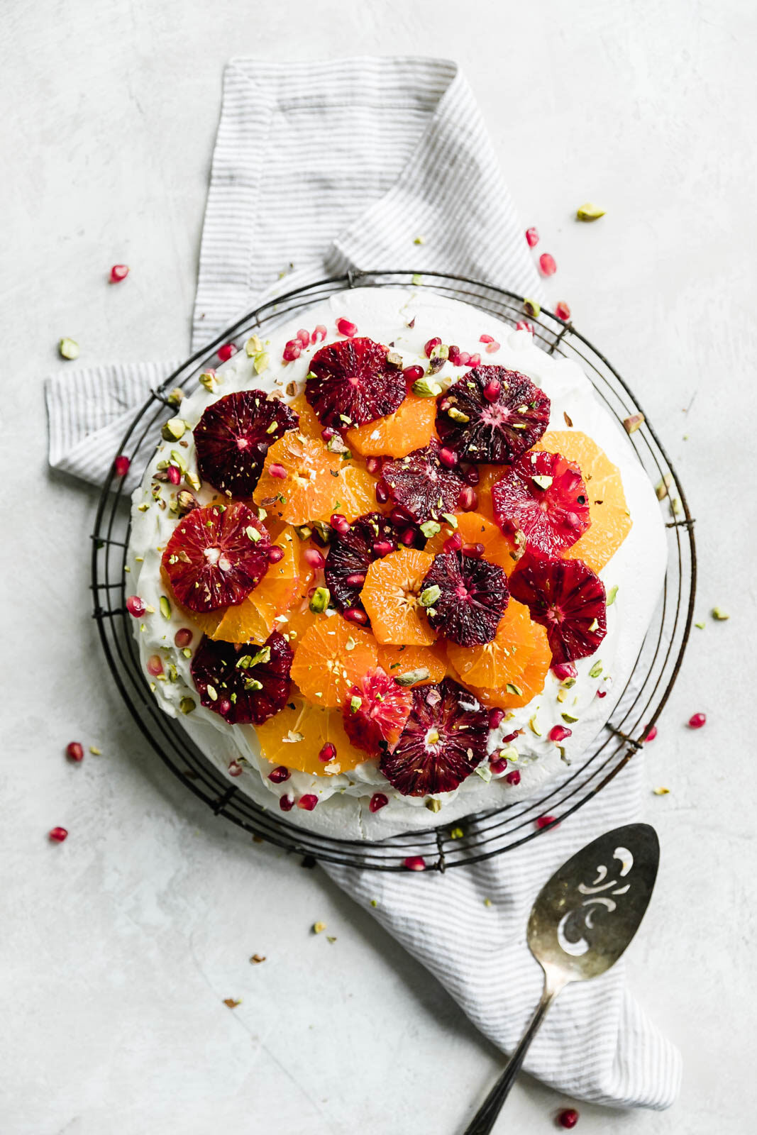 A light and fluffy Winter Citrus Pavlova that's basically a giant meringue topped with whipped cream and juicy winter citrus fruits. Oh baby.