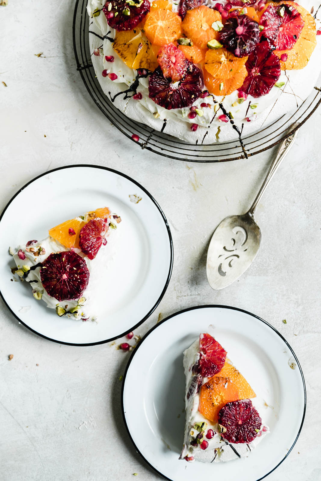 slice of citrus pavlova cake on a plate