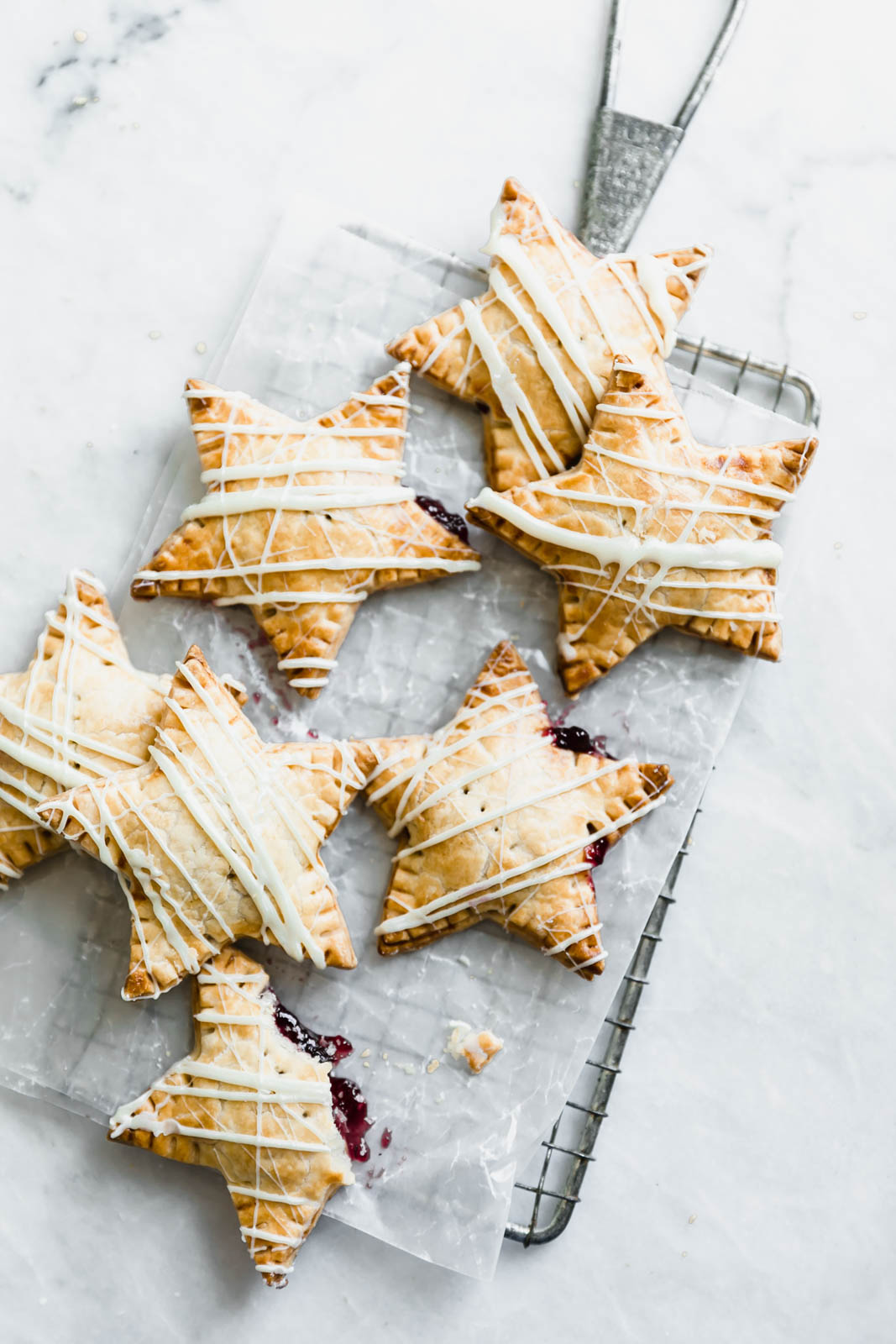 Sometimes, you just want pie. And some of those sometimes, you want pie that fits in your hand. Enter: these White Chocolate Blueberry Star Shaped Hand Pies