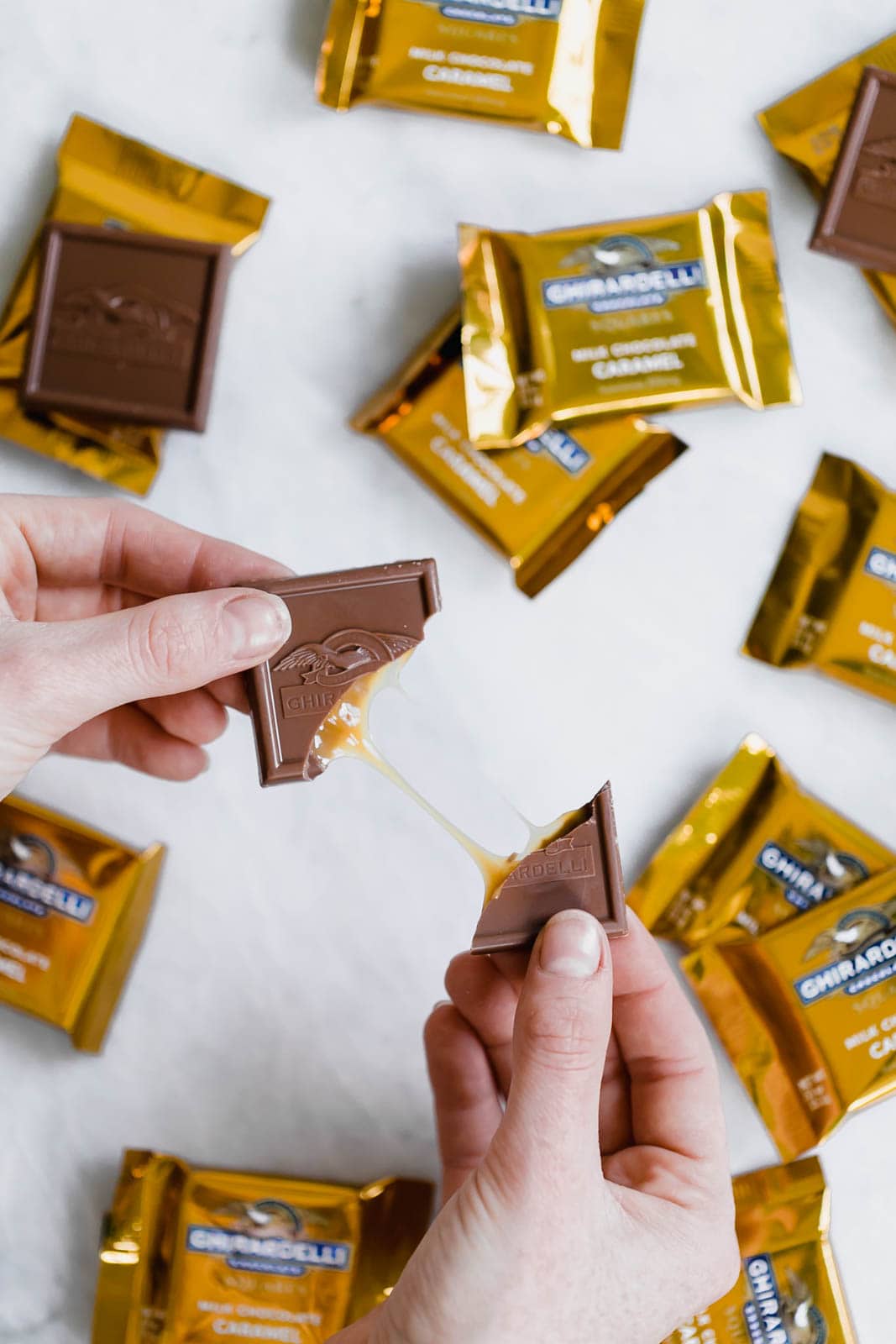 breaking open a piece of chocolate