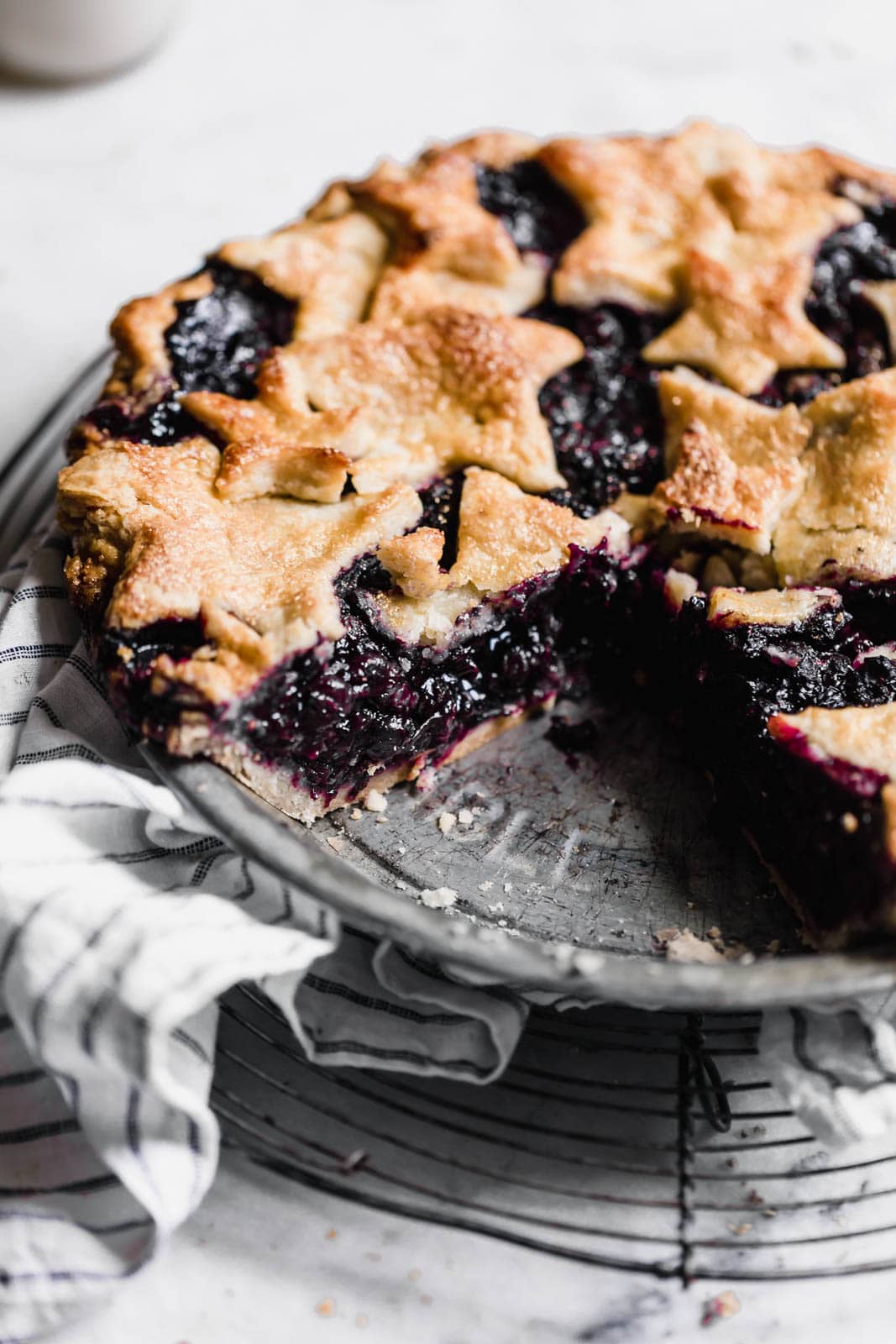 blueberry pie with slice missing