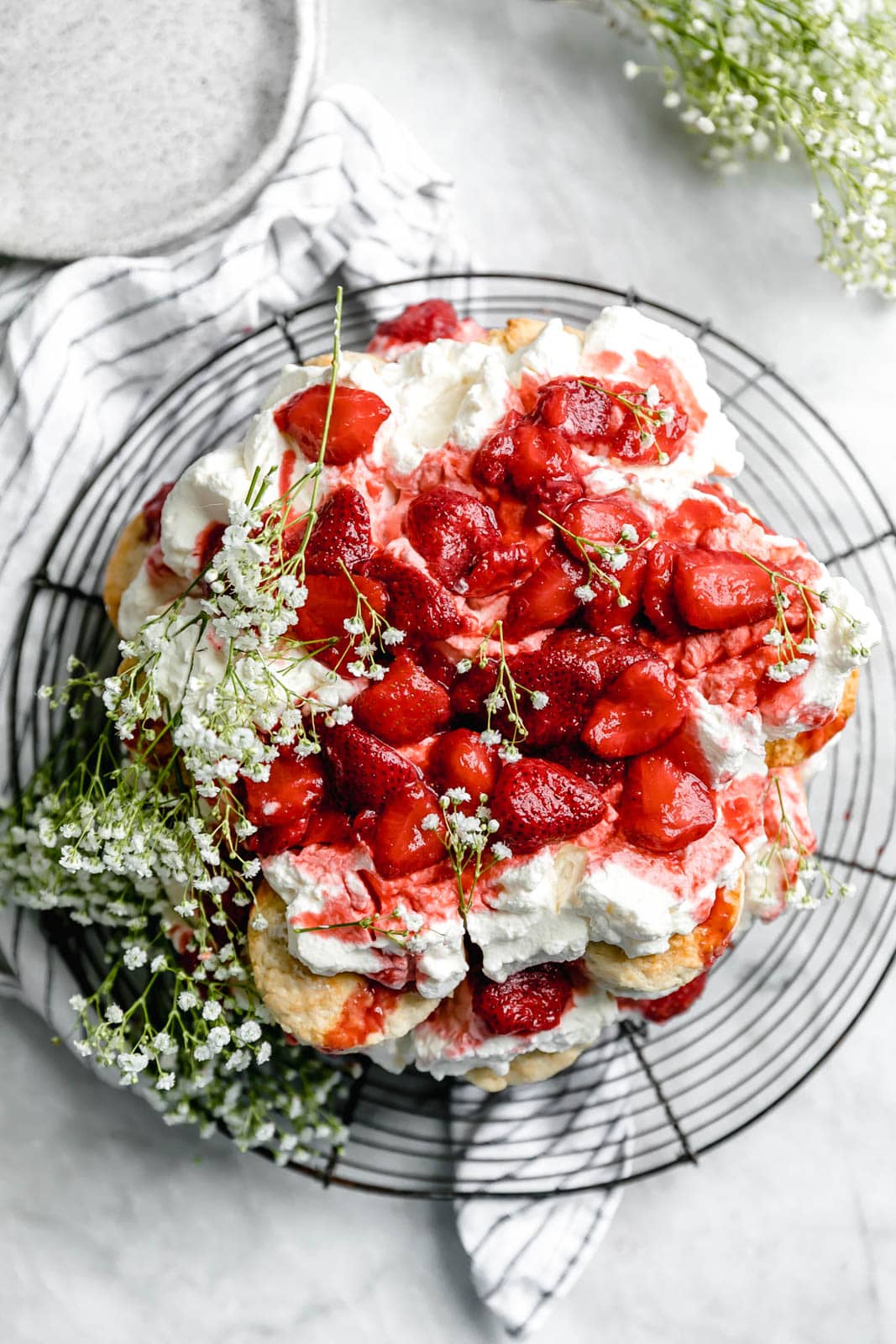 strawberry shortcake cake on wire rack