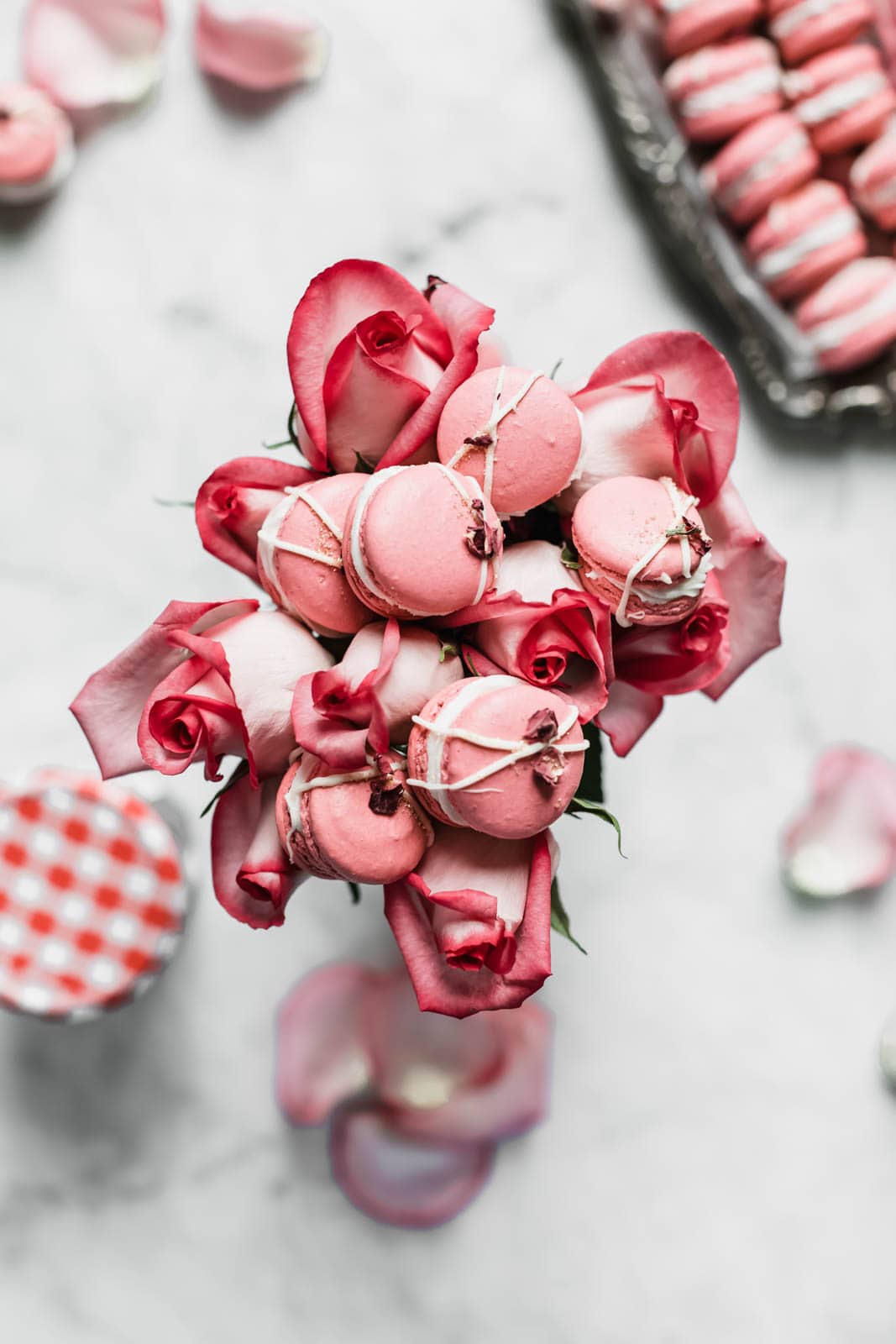 Raspberry Rose Macarons made with rosewater, a vanilla buttercream, and a surprise raspberry preserve center. Simple, elegant, and oh so delicious!! 