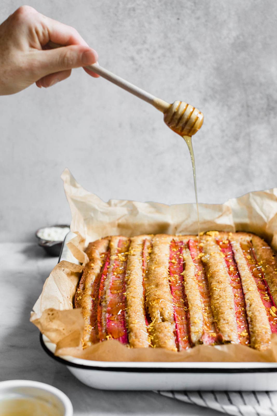 A rustic rhubarb almond honey cake with a hint of orange zest and wildflower honey. A perfect one-bowl snack cake ready in just 45 minutes!