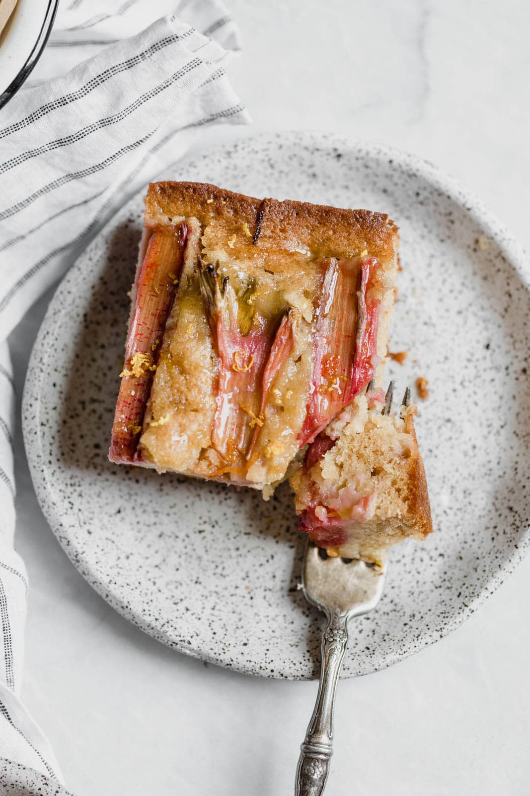 A rustic rhubarb almond honey cake with a hint of orange zest and wildflower honey. A perfect one-bowl snack cake ready in just 45 minutes!