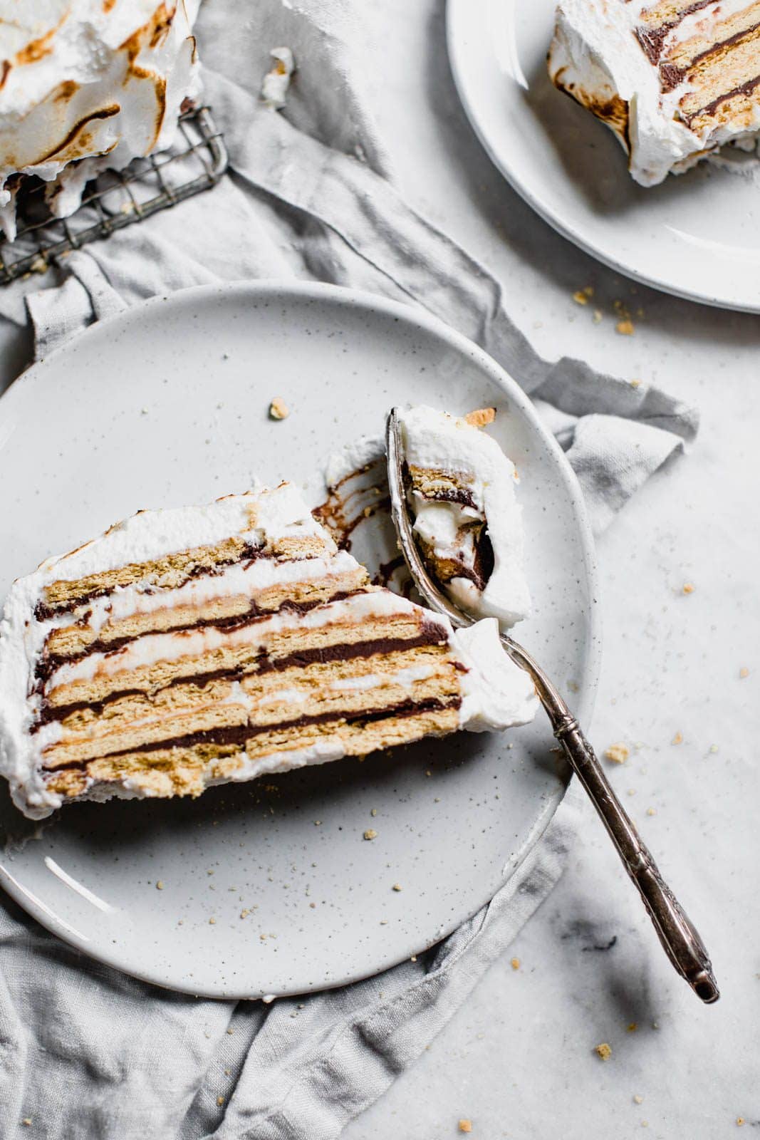 s'mores ice box cake on a plate with fork