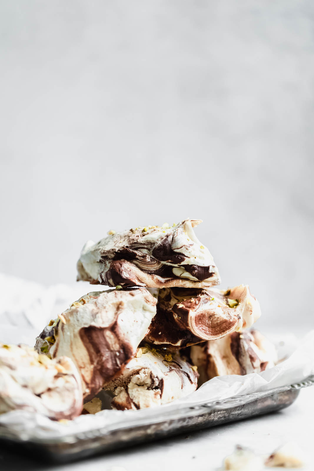 The easiest chocolate swirled spoon meringues that you literally spoon onto a baking sheet. Top 'em with crumbled pistachios, bake, and done!