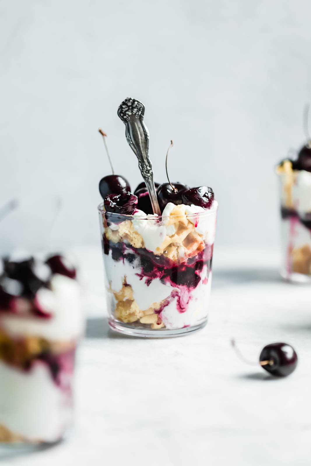 Layers of quick sautéed black cherries, fresh whipped cream, and Belgian waffles make this no-bake waffle parfait a total no-brainer summer dessert.
