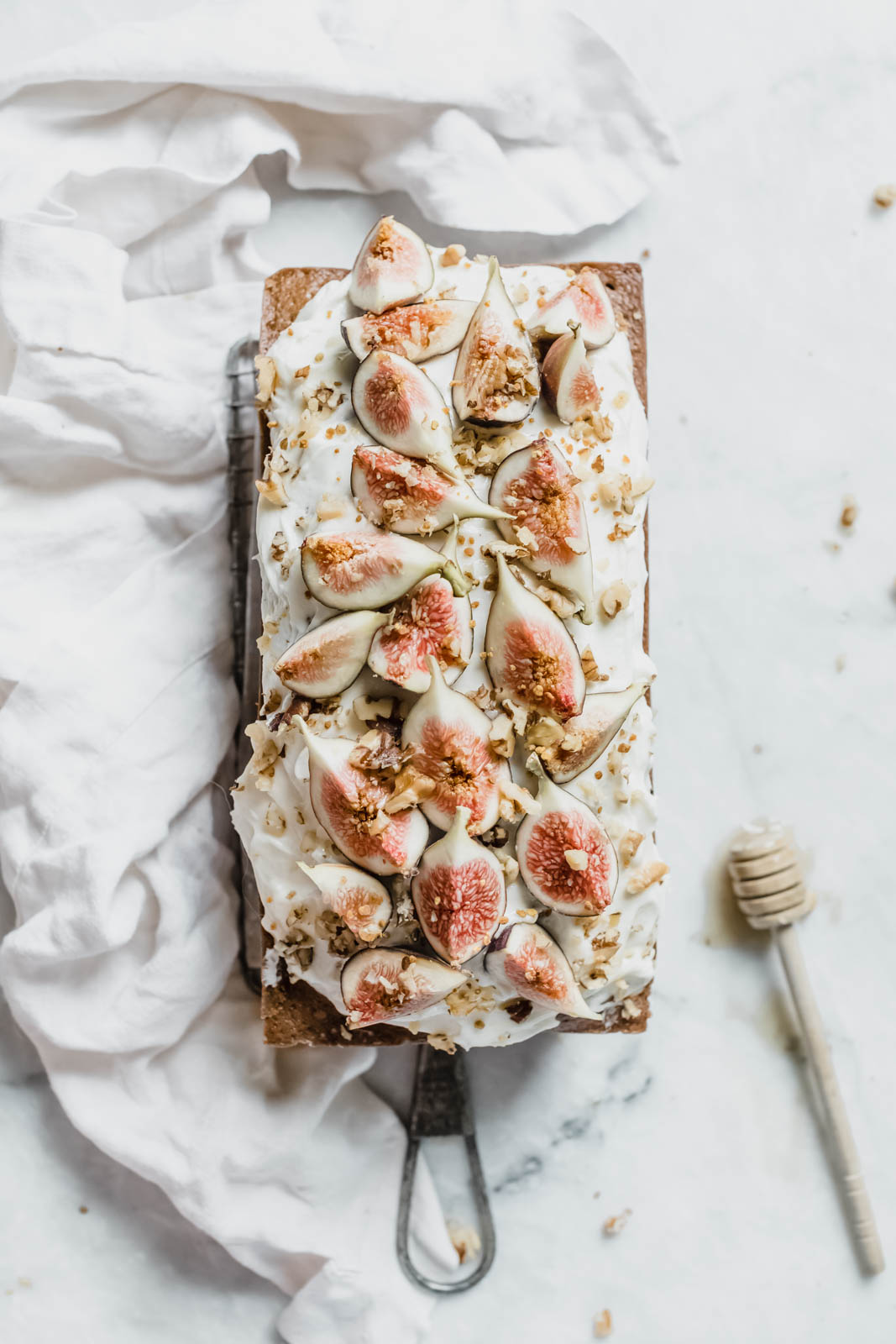 A beautifully simple one bowl honey cake spiced with cinnamon, orange, and black tea, and topped with fresh figs and a goat cheese frosting!