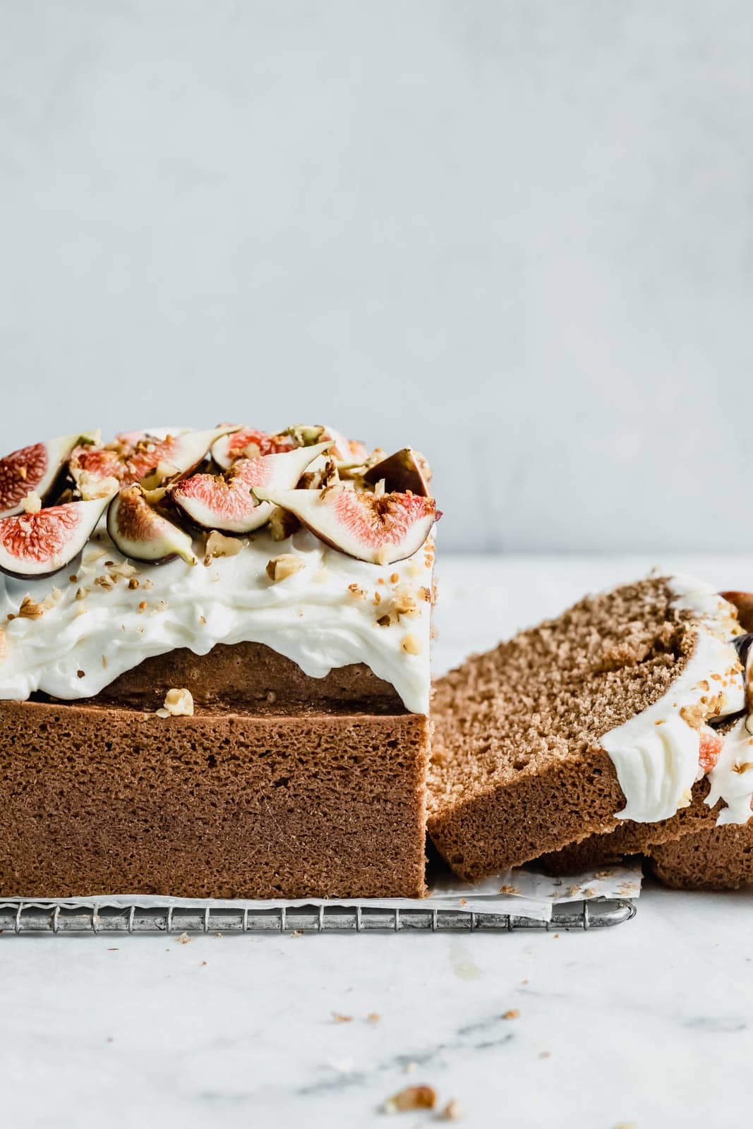 A beautifully simple one bowl honey cake spiced with cinnamon, orange, and black tea, and topped with fresh figs and a goat cheese frosting!