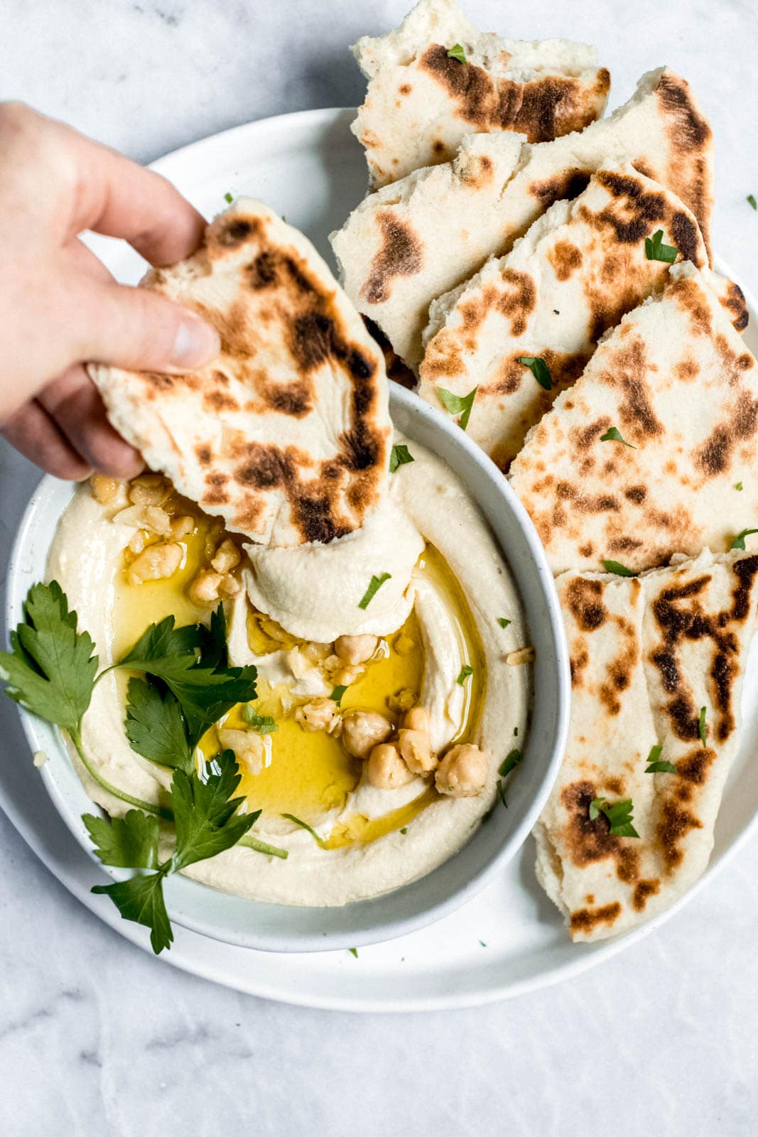 pita bread with hummus drizzled with olive oil