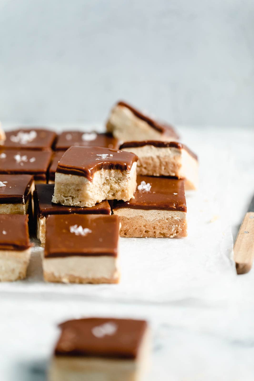 Middle Eastern Millionaire's Shortbread sliced on parchment paper
