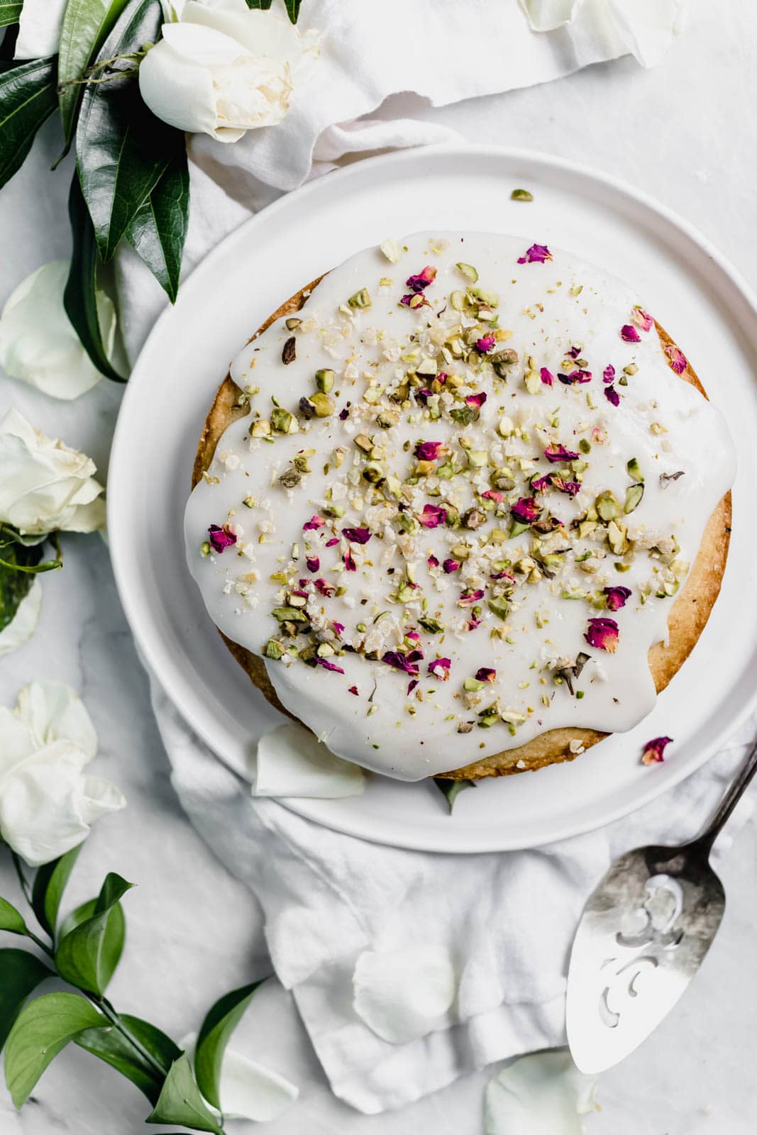 almond and rose cake on a plate