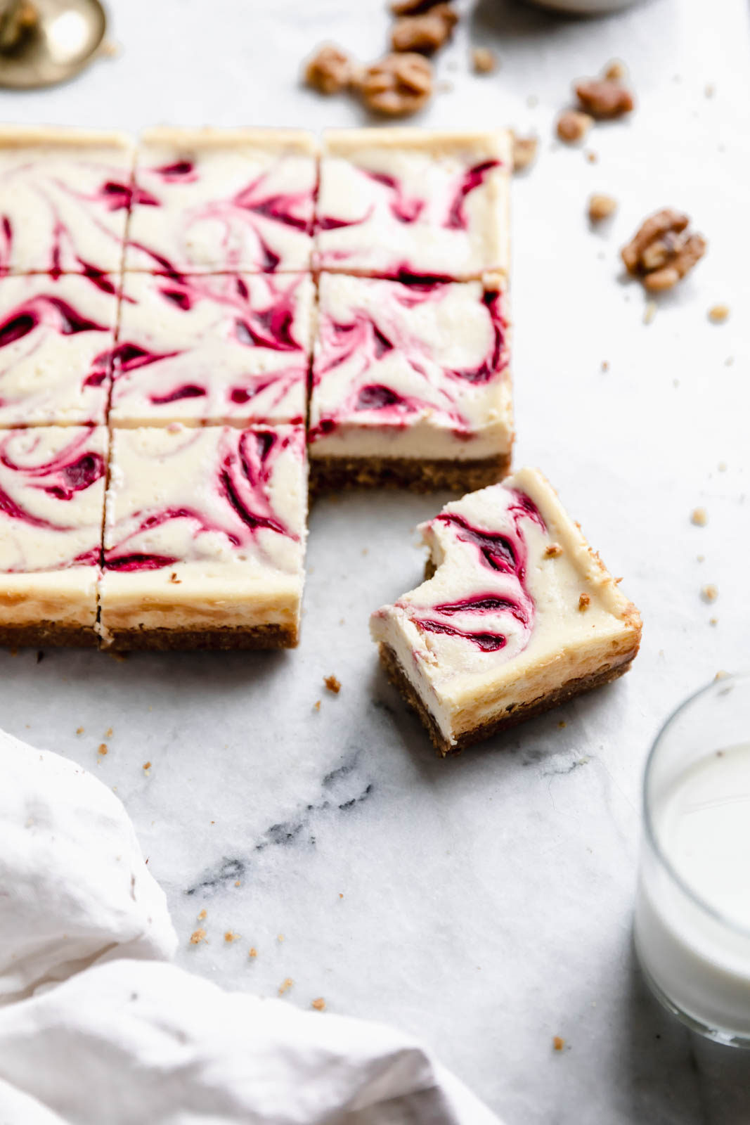 Walnut Cranberry Cheesecake Bars on countertop