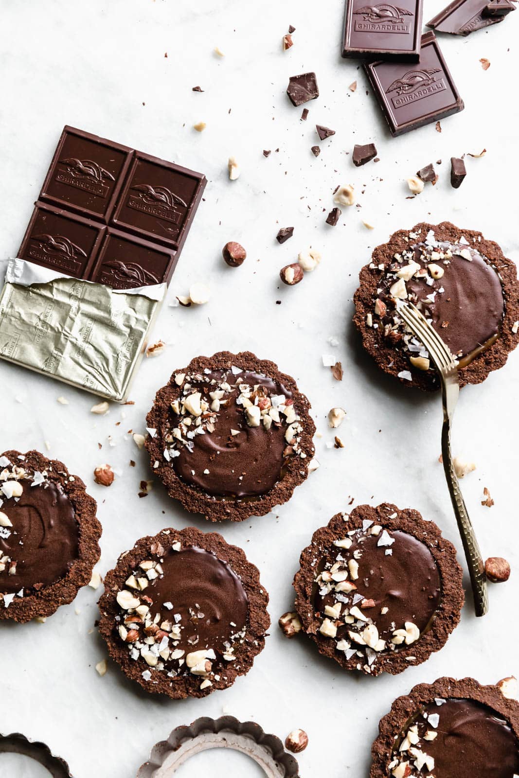 I’ve never met a tart I didn’t like, but these Salted Caramel Chocolate Tarts with a chocolate graham crust and toasted hazelnuts are on another level.