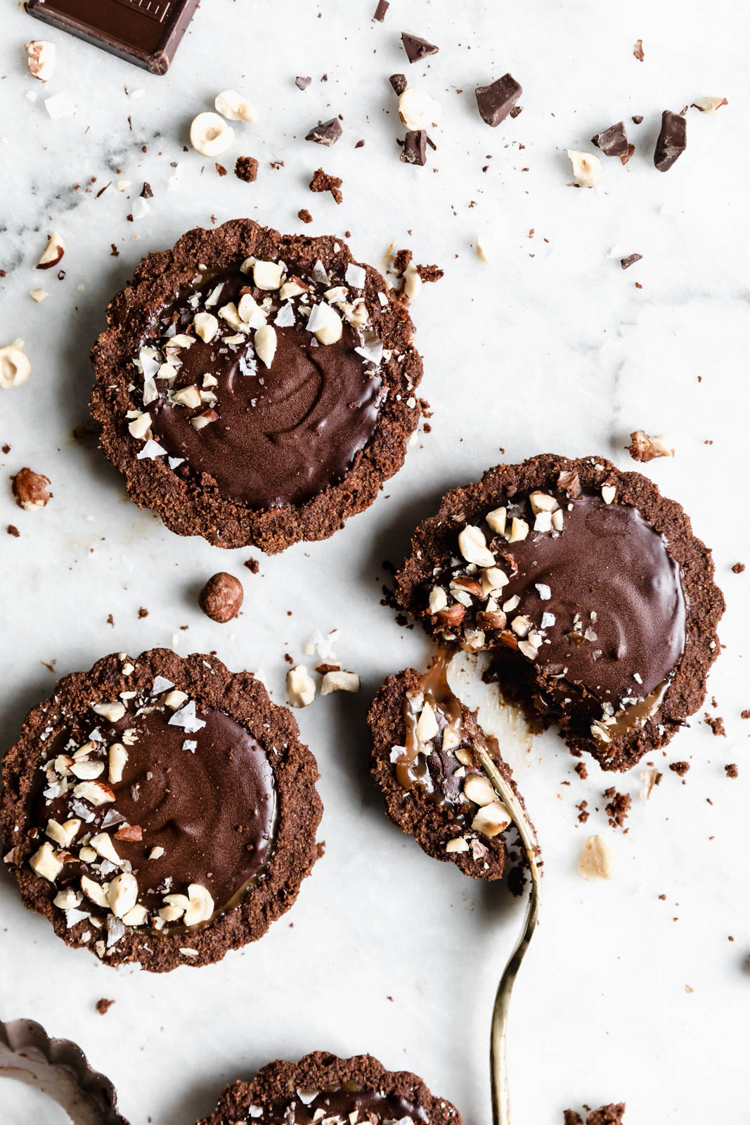 I’ve never met a tart I didn’t like, but these Salted Caramel Chocolate Tarts with a chocolate graham crust and toasted hazelnuts are on another level.