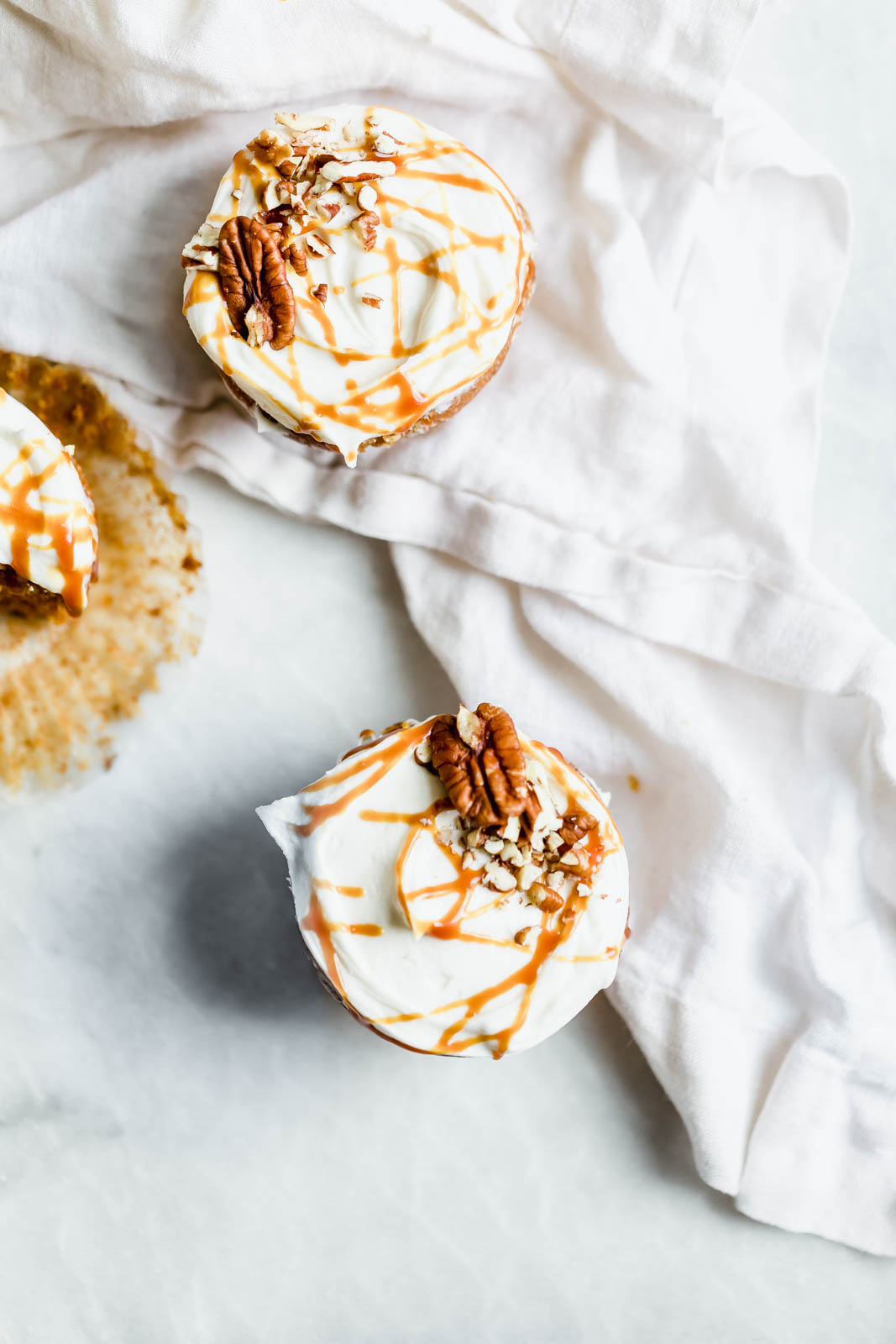 The perfect winter cupcake is here! Sweet potato cupcakes flavored with cinnamon and ginger and topped with a tangy cream cheese frosting.
