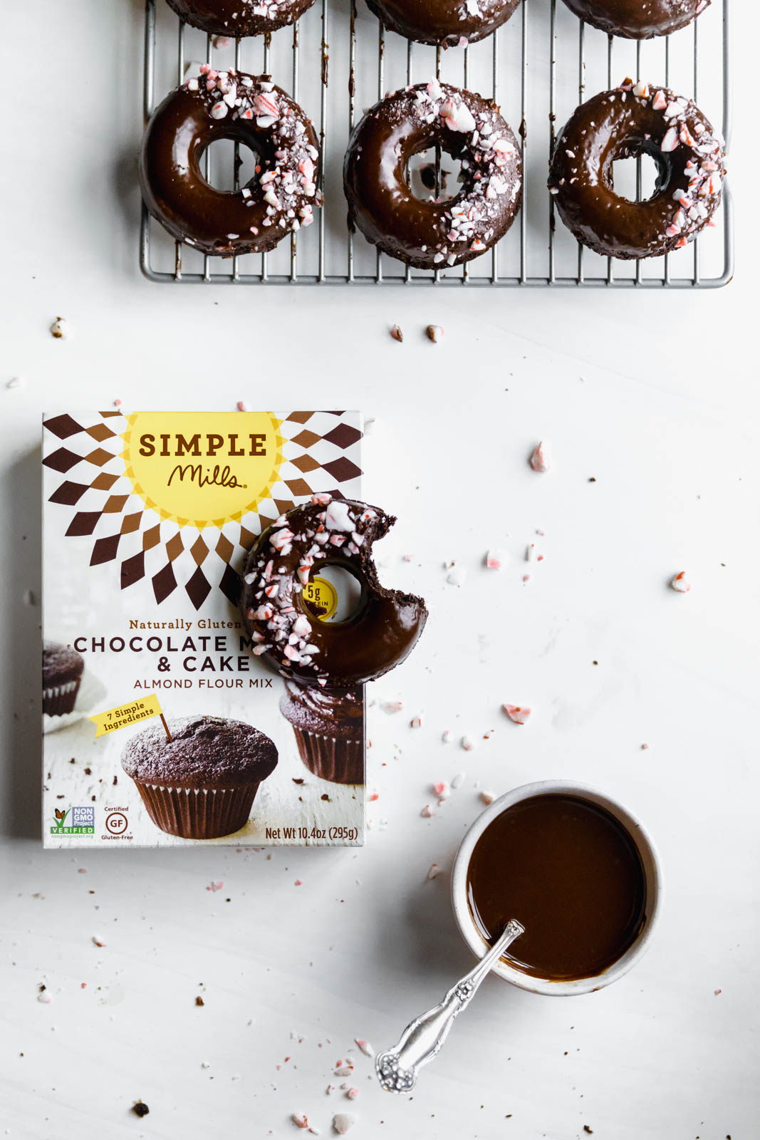 Ultra moist dairy-free and grain-free baked Peppermint Chocolate Donuts made topped with a dark chocolate ganache and candied peppermints. NOM.