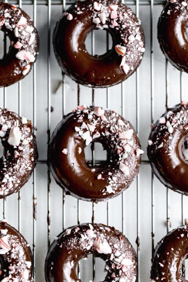 Ultra moist dairy-free and grain-free baked Peppermint Chocolate Donuts made topped with a dark chocolate ganache and candied peppermints. NOM.