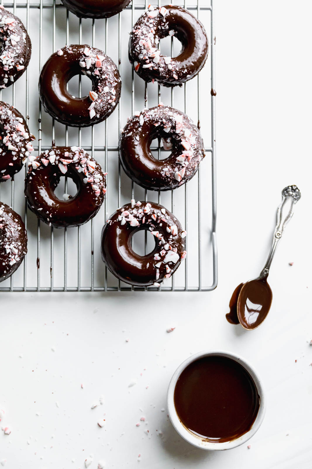 Ultra moist dairy-free and grain-free baked Peppermint Chocolate Donuts made topped with a dark chocolate ganache and candied peppermints. NOM.
