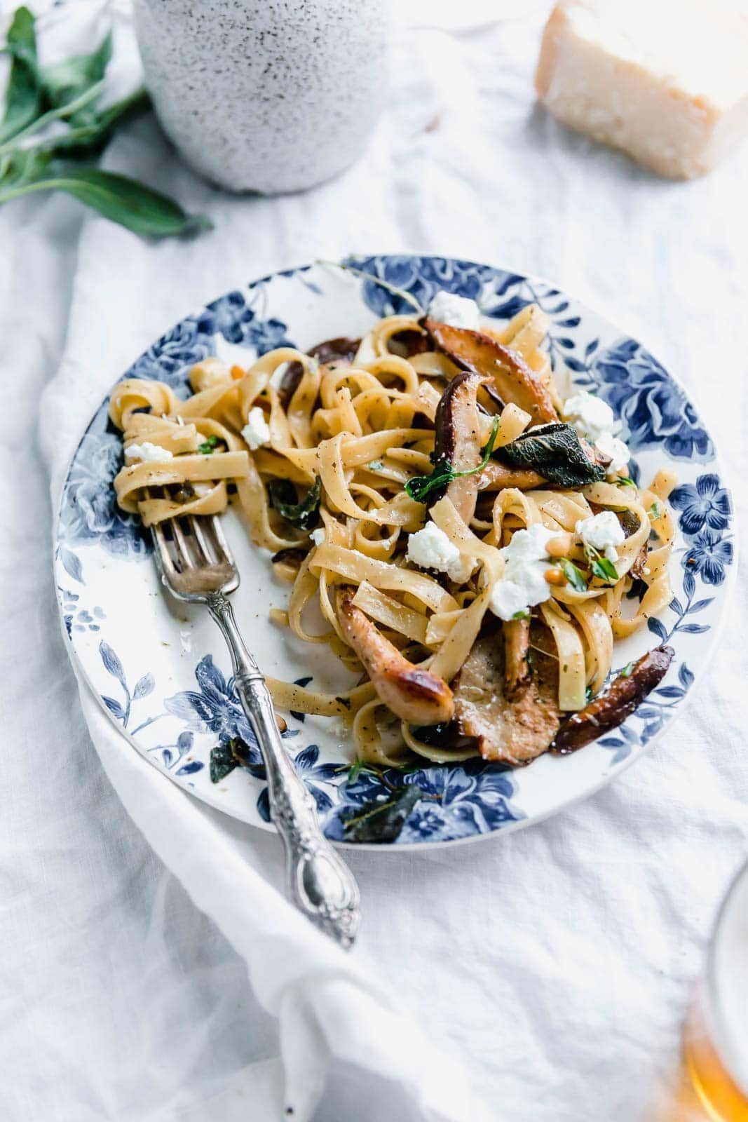 A hearty Herby Mushroom Tagliatelle flavored with brown butter sage shiitakes, toasted pinenuts, and goat cheese. Get in my belly. Stat.