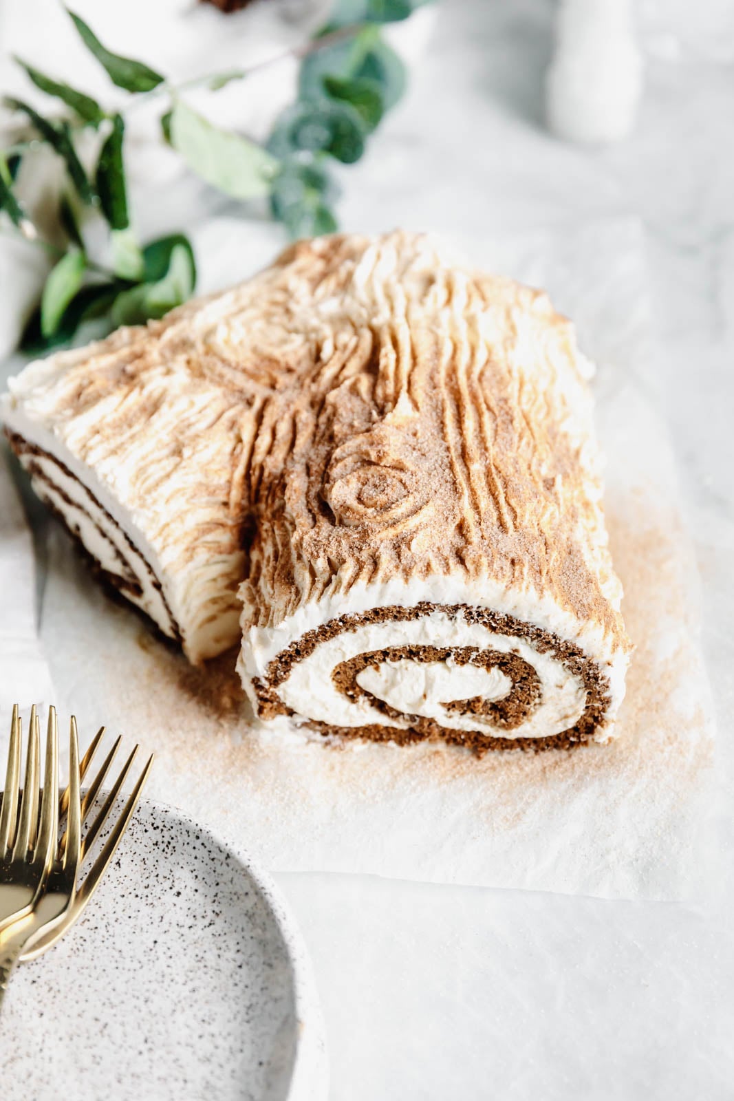 This festive White Chocolate Gingerbread Yule Log is a showstopper Christmas dessert. Made with white chocolate buttercream "bark" for that rustic look!