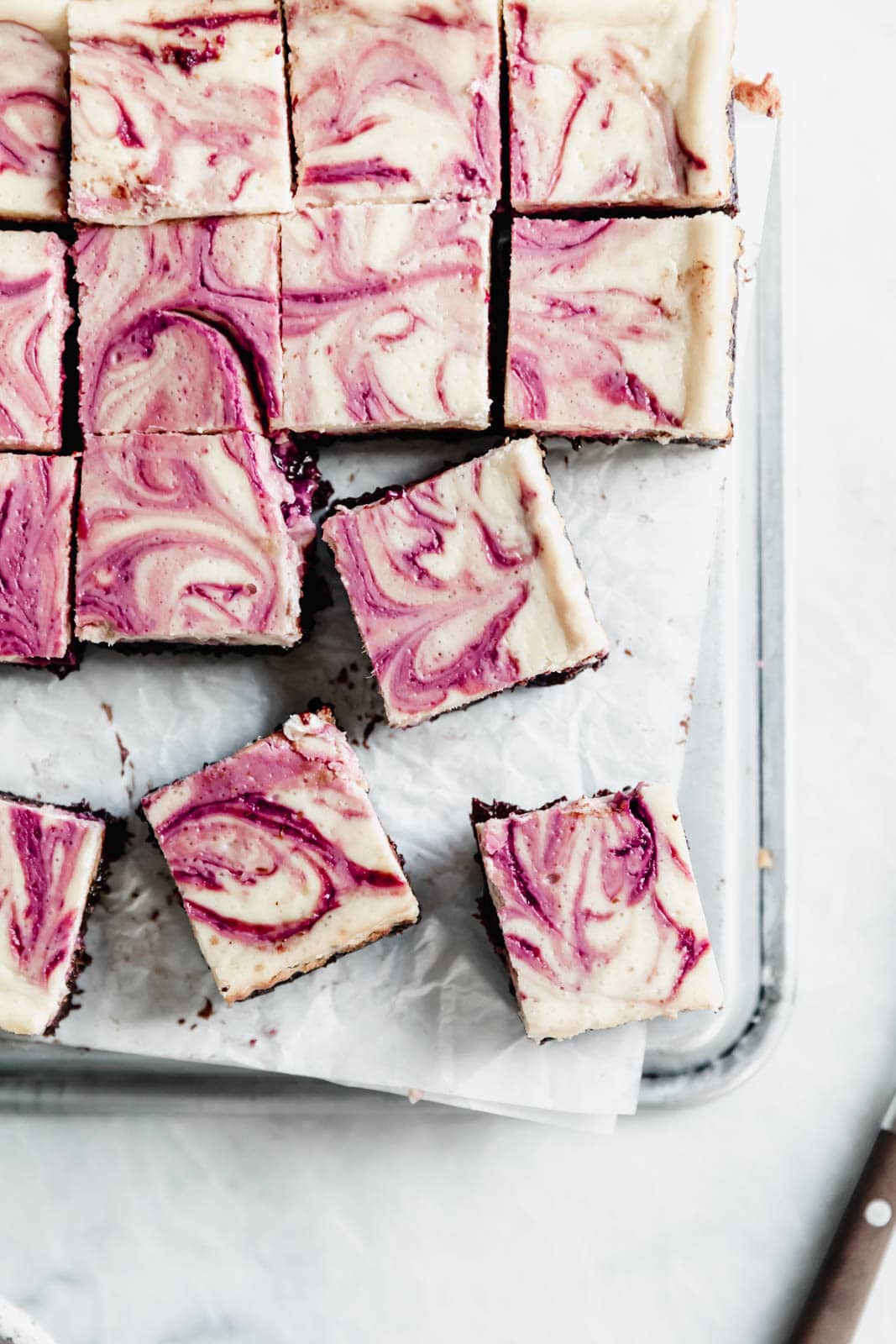 Black Cherry Cheesecake Brownies so rich and delicious you won't be able to stop at just one! Made with a black cherry swirl and fudgy brownie bottom.