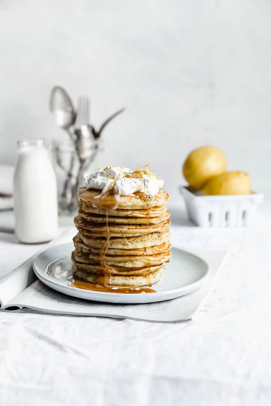Light and fluffy Gluten Free Lemon Poppy Seed Pancakes made with almond flour and lemon zest. But proceed with caution: you might eat the whole batch!