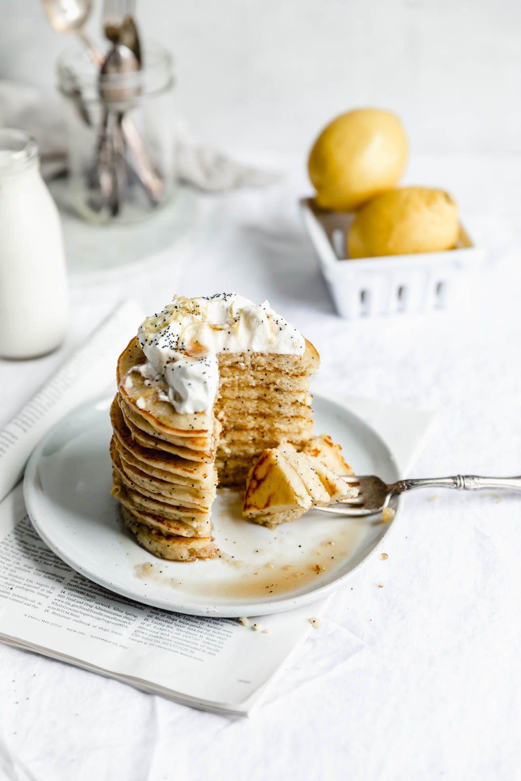 Light and fluffy Gluten Free Lemon Poppy Seed Pancakes made with almond flour and lemon zest. But proceed with caution: you might eat the whole batch!