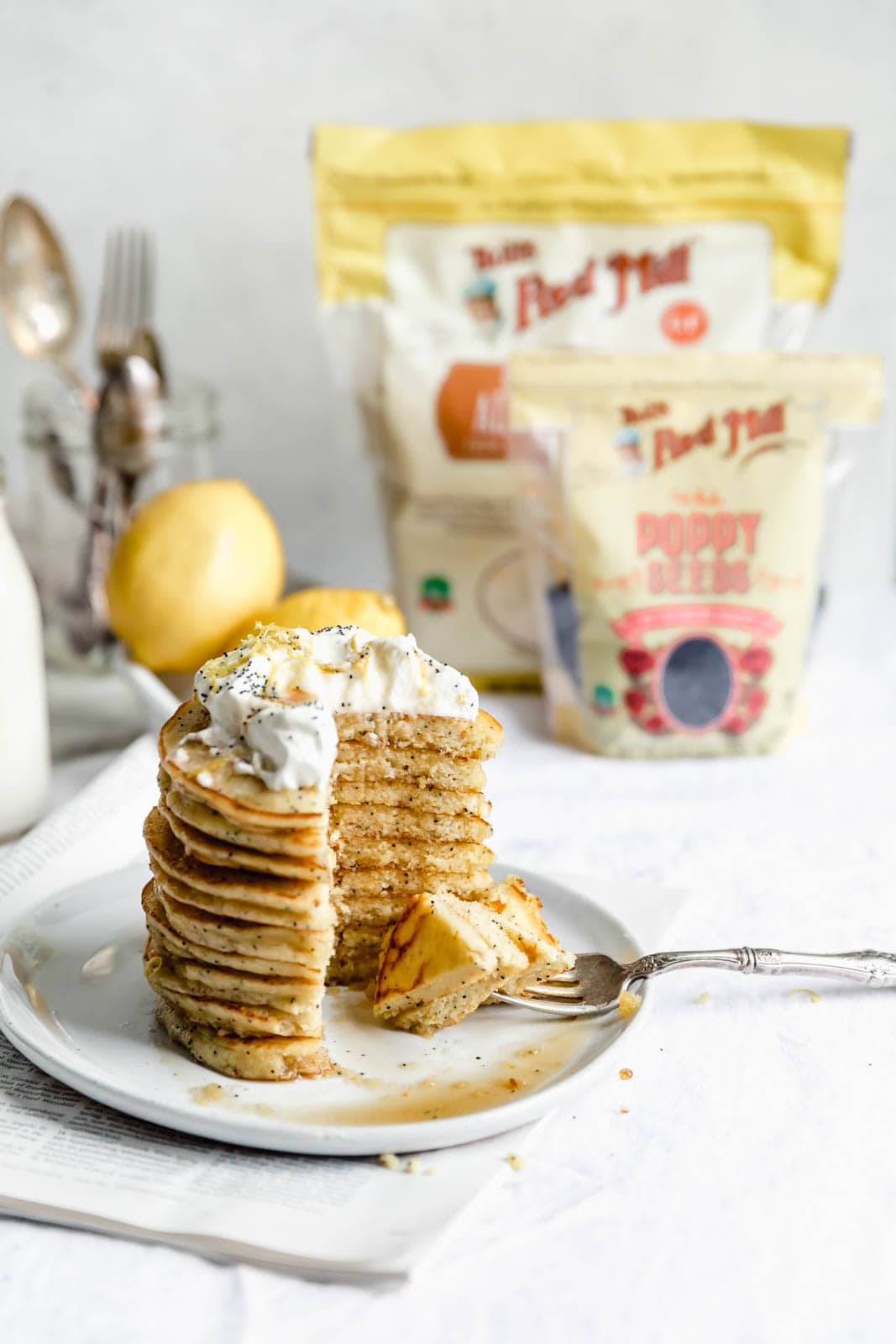 Light and fluffy Gluten Free Lemon Poppy Seed Pancakes made with almond flour and lemon zest. But proceed with caution: you might eat the whole batch!